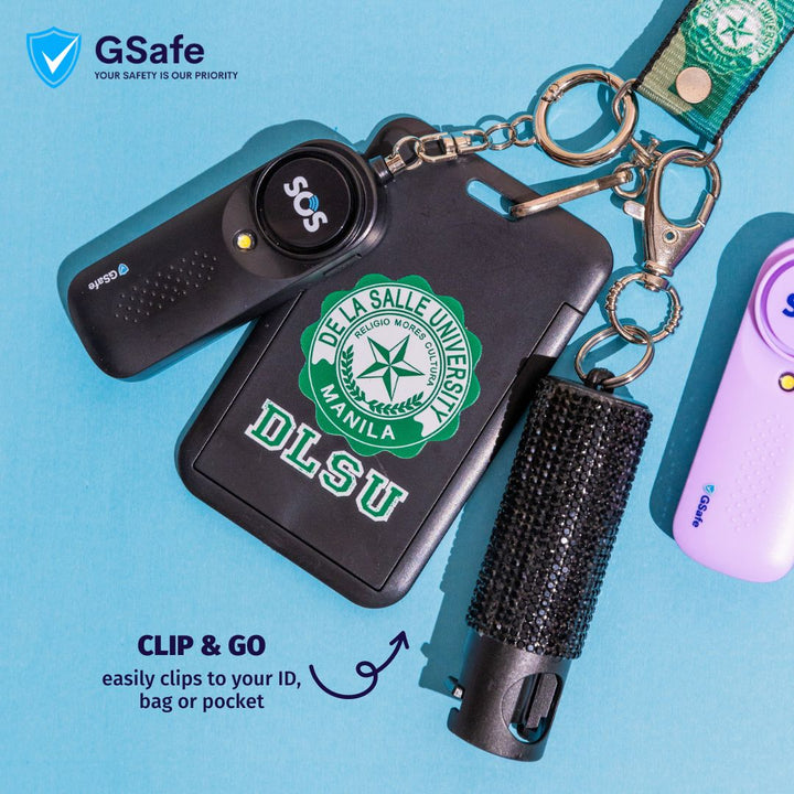 GSafe pepper spray keychain clipped to an ID holder, bag, or pocket for quick access and everyday personal safety carry.